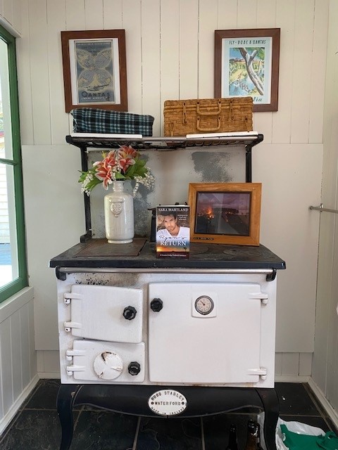 Woodstove in country cottage with book displayed